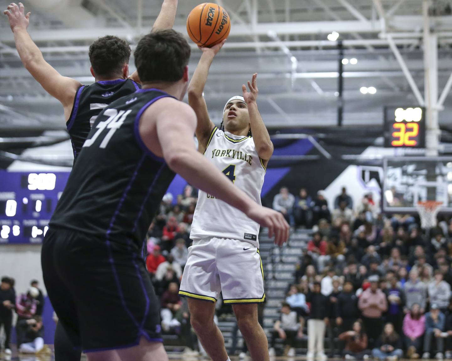 Yorkville Christian's Tray Alford (4) puts up an elbow jumper during their Plano Christmas Classic semi-final basketball game between Yorkville Christian at Plano Monday, Dec 29, 2025 in Plano.