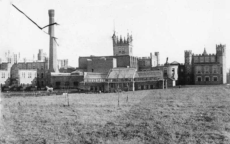 The rarely viewed north side of Altgeld Hall showing the greenhouse at Northern Illinois State Normal School (now NIU) looking south from Lucinda Avenue, circa 1906.