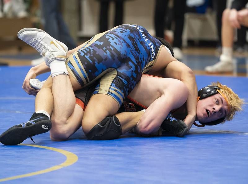 Wrestling in the 165 pound bout, Crystal Lake Central's Tommy Tomasello, bottom, takes on Wheeling's Nichlos Montesinos during the Class 2A Dual Team wrestling Sectional on Tuesday, February 25, 2025 at Wheeling High School. Ryan Rayburn for Shaw Local
