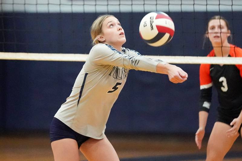 Oswego East's Laila Mossey (5) sets the ball against Minooka during a Southwest Prairie Conference match in Oswego on Thursday, Sept. 18, 2025.