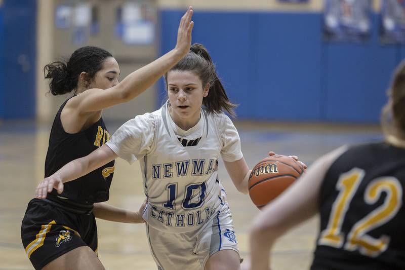 Newman’s Helen Papoccia drives to the hoop against Riverdale Thursday, Feb. 2, 2023.