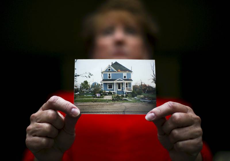 Dawn Kelly, whose home and property was damaged in the 1990 Plainfield Tornado, still resides at her home 25 years later.