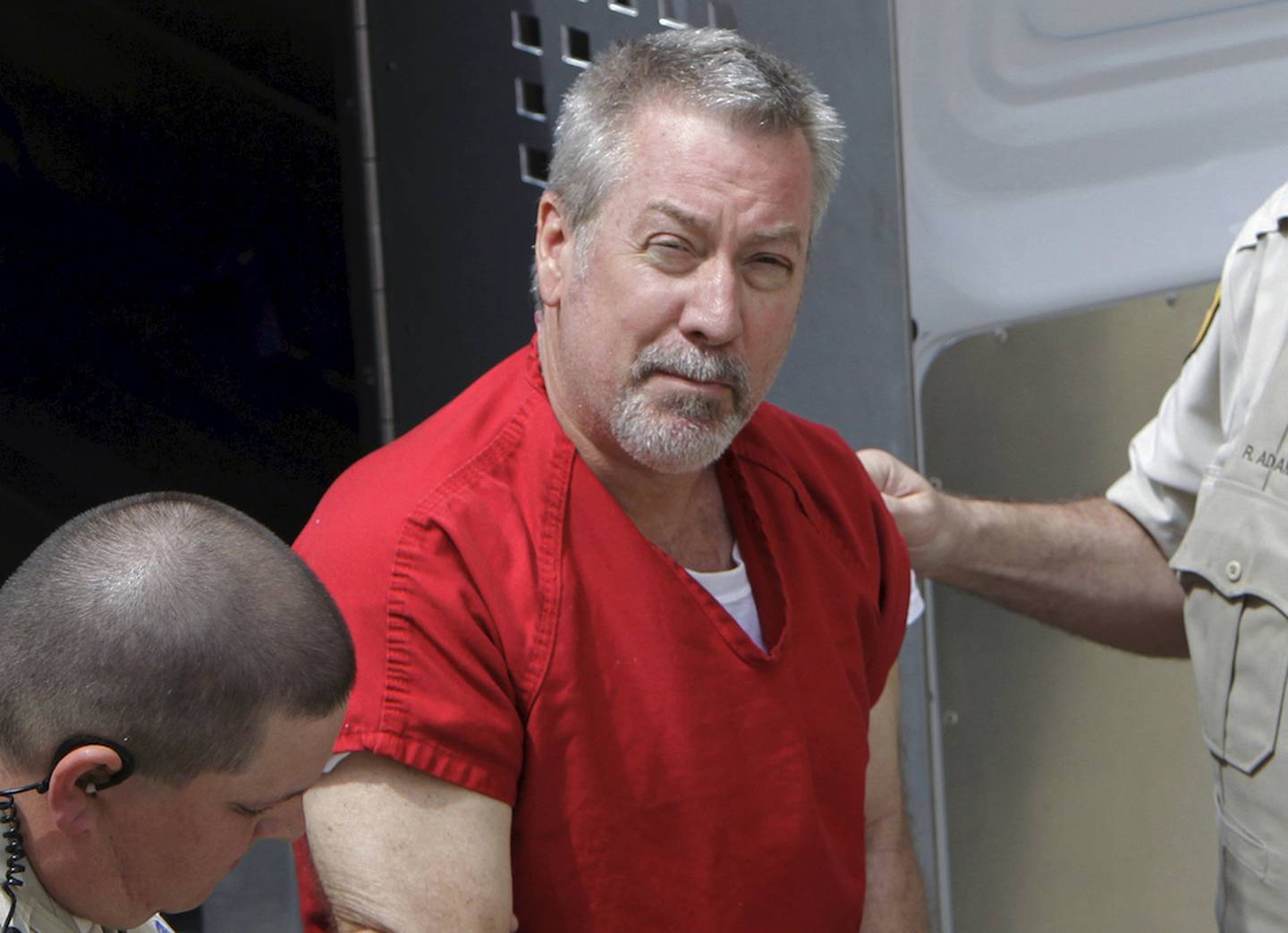 In this May 8, 2009 file photo, former Bolingbrook police officer Drew Peterson arrives for court in Joliet. Peterson is serving a 38-year sentence for killing Kathleen Savio, and is a suspect in the disappearance of his fourth wife, Stacy Peterson. The Bolingbrook Police Pension Board voted unanimously Wednesday to compel Drew Peterson to provide deposition testimony in a case that will determine whether his pension should be taken away from him.