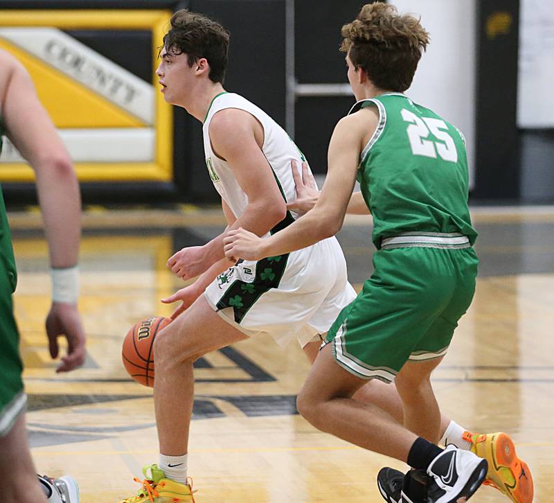 Seneca's Kysen Klinker dribbles around Dwight's Joey Starks as he looks to pass the ball off during the Tri-County Conference Tournament on Wednesday, Jan. 25, 2023 at Putnam County High School.