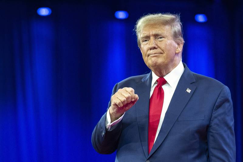 FILE - Republican presidential candidate former President Donald Trump pumps his fist as he departs after speaking during the Conservative Political Action Conference, CPAC 2024, in Oxon Hill, Md., Feb. 24, 2024. A Cook County judge ordered the Illinois State Board of Elections to take former President Donald Trump's name off of the state's March 19 primary ballot Wednesday, Feb. 28, 2024, but placed her order on hold until Friday to allow an appeal. (AP Photo/Alex Brandon, File)