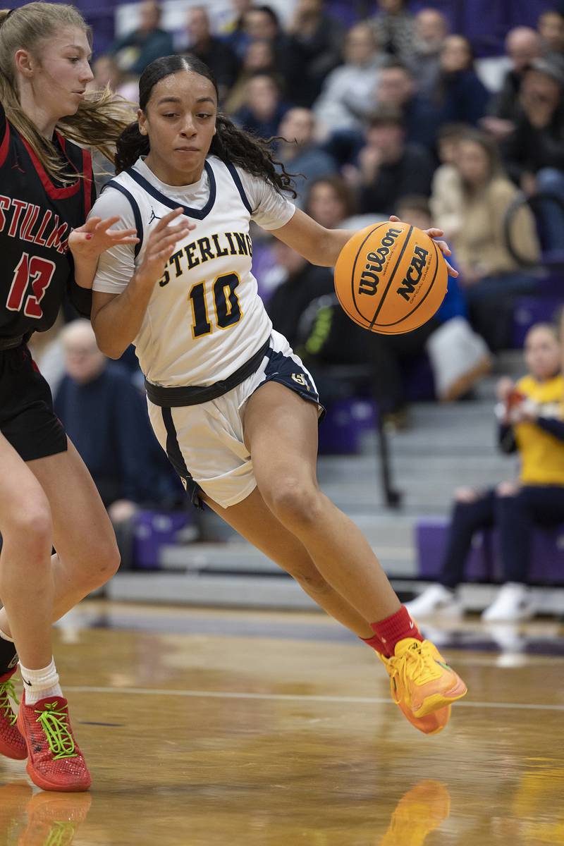 Sterling’s Nia Harris drives past Stillman Valley’s Amelia Dunseth Friday, Dec. 27, 2024, during the Dixon Girls KSB Holiday Basketball Classic.