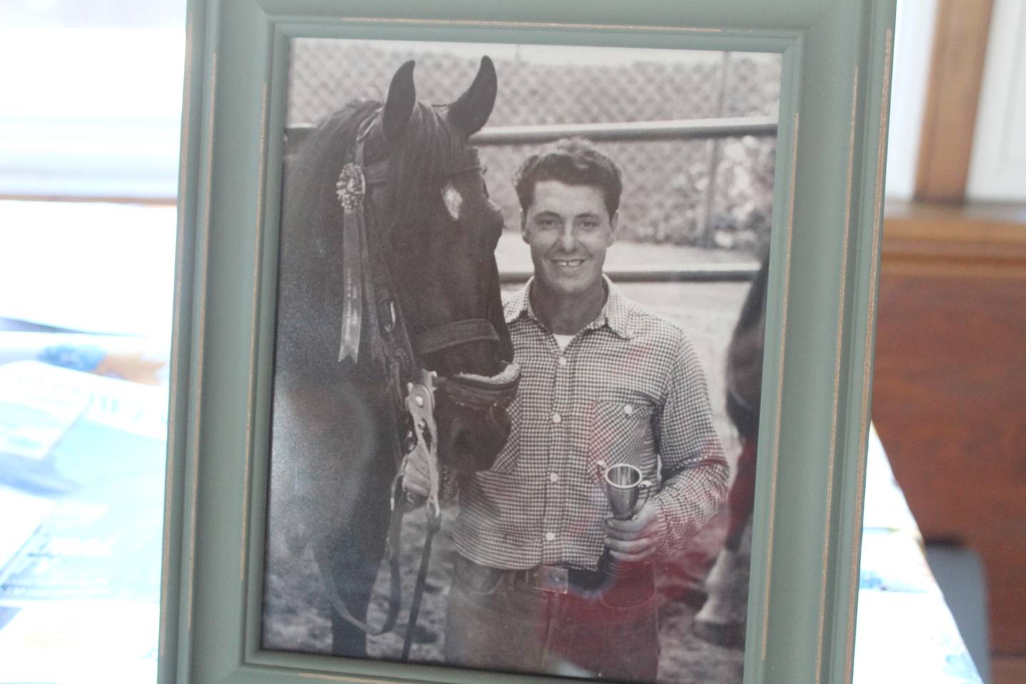 A photo of World War II veteran Peter Cirelli with one of his horses he owned after the war.