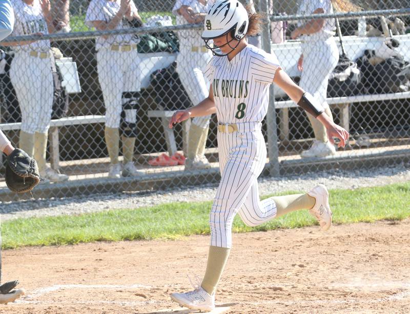 St. Bede's Lili Bosnich scores a run against Woodland/Flanagan-Cornell on Monday, April 29, 2024 at St. Bede Academy.