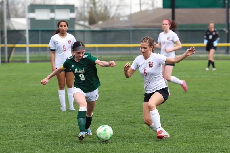 Bishop McNamara's Isabelle Kuntz, left, and Bradley-Bourbonnais' Lilly Argyelan vie for possession during the Boilermakers' 9-1 win over Bishop McNamara in All-City play on Tuesday, March 31, 2026.
