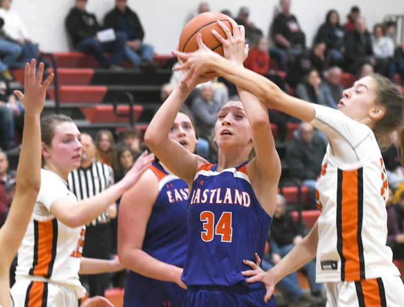 Eastland's Trixie Carroll draws a foul as she shoots against Winnebago during Nov. 18 action at Forreston's Girls Thanksgiving Tournament.