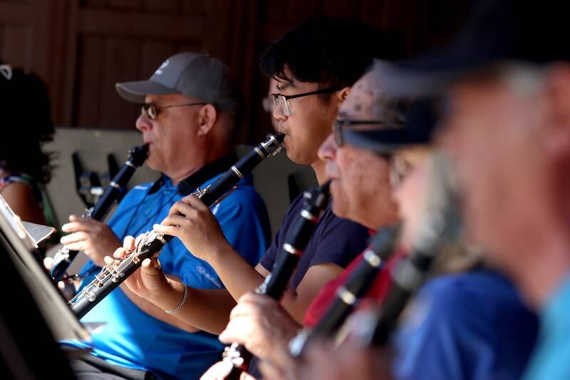 Members of the Knock on Wood Clarinet Ensemble entertain during Monarchs and Music at Crystal Lake Main Beach Sunday.