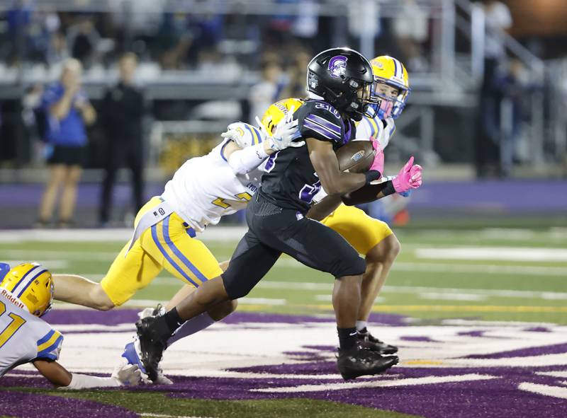 Downers Grove North's James Lumpkin (30) makes a run during the varsity football game between Downers Grove North and Lyons Township on Friday, Oct. 11, 2024 in Downers Grove.