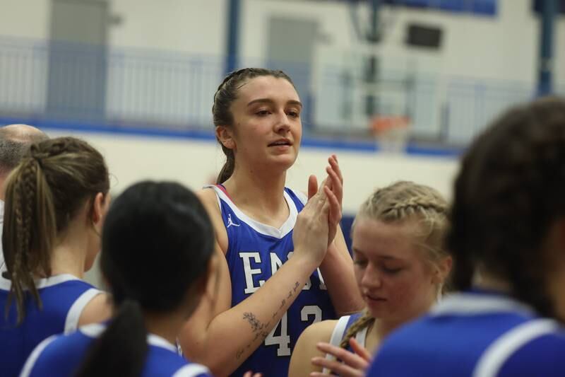 Lincoln-Way East’s 6’6’’ Forward Hayven Smith towers above her teammates during a timeout against Romeoville in the Sandburg Holiday Classic semifinal on Thursday, Dec. 28th, 2023 in Orland Park.