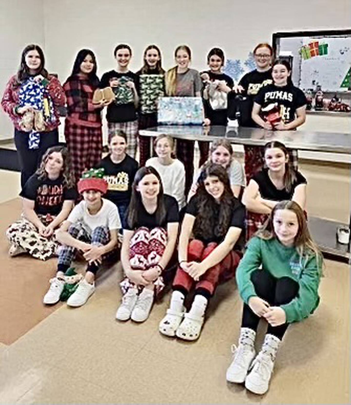 The PCJH cheerleaders are spreading Christmas cheer this holiday season.  They wrapped up some warm pajamas and cozy slippers for five kids that are spending Christmas at IV Pads. Pictured are (front row, from left to right) Kynzie Thomas, Brooklyn Gorski, Naomi Hammerich and Jolene Poole; (middle row) Tessa Gerling, Savannah Grasser, Shelby Willard, Eden  Carlson andSarah Schennum; and (back row) Makenzie Setters, Alicia Vasquez-Barrares, Sofia Borri, Avery Grasser, Piper Terando, Ella Schrowang, Samantha Marciniak and Aurora Bickerman. Not Pictured: Laci Lemke.