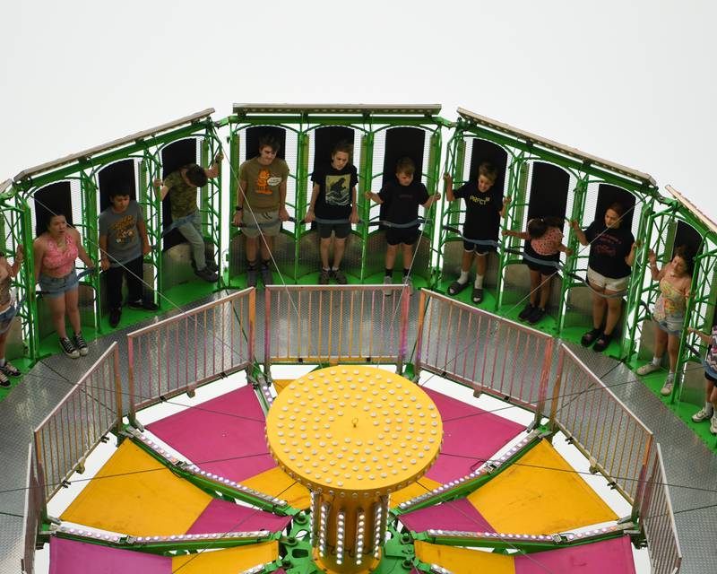 Community members enjoy the fire ball ride on Thursday June 12, 2025, during PrairieFest held at PrairieFest Park in Oswego.
