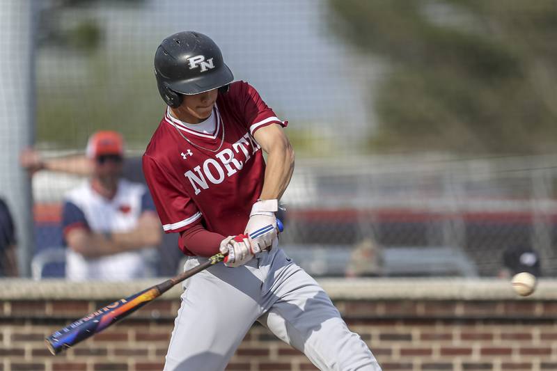 Plainfield North's Tanner Grimes (11) swings at a pitch during baseball game between Plainfield North at Oswego, Thursday, April 24, 2025 in Oswego.