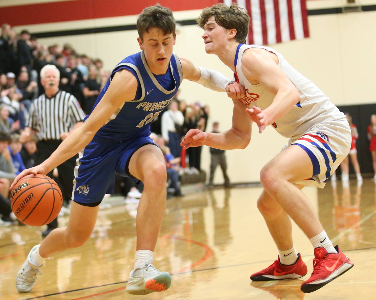 Princeton's Tyson Phillips runs around Morrison's Chase Newman during the Class 2A Regional final game on Friday, Feb. 23, 2024 at Erie-Prophetstown High School.