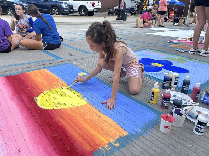 Avery VenHuizen creates a colorful scene Saturday, Sept. 21, at Paint the Town in Morrison.