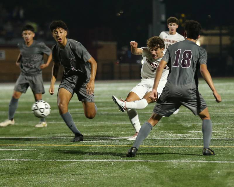 Naperville North's Noah Radeke (7) kicks on goal during soccer match between Naperville North at Morton.  Sept 21, 2023.