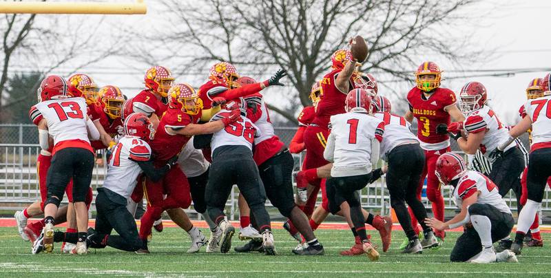 Batavia's Jack Sadowsky (6) blocks a field goal attempt by Yorkville's Hudson Fiene (1) during a 7A quarterfinal playoff football game at Batavia High School on Saturday, Nov 12, 2022.