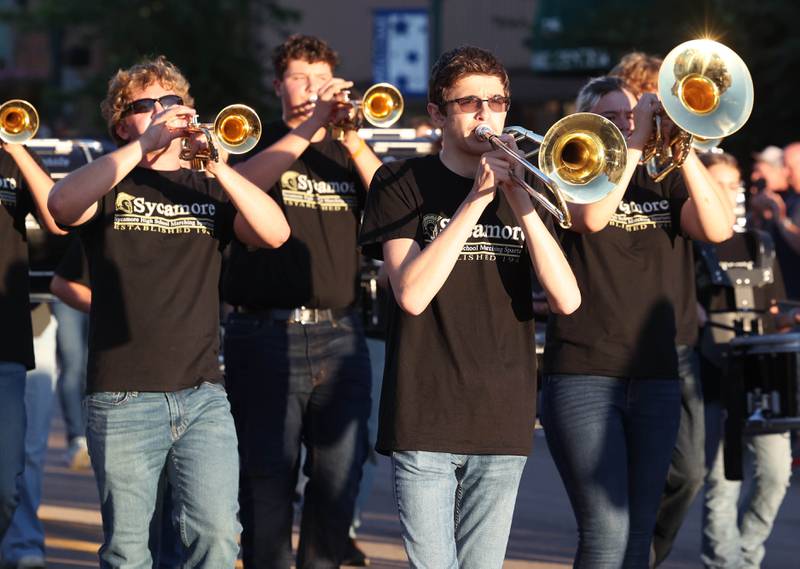 Members of the marching band make their way down State Street in Sycamore Wednesday, Sept. 25, 2024, during the Sycamore High School homecoming parade.