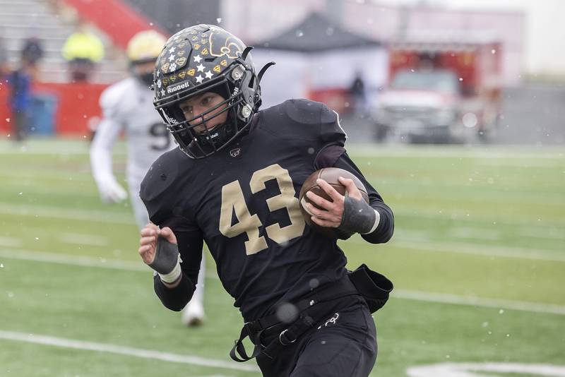 Lena-Winslow's Alec Schlichting runs the ball against Althoff Catholic Friday, Nov. 29, 2024, in the class 1A football state final.