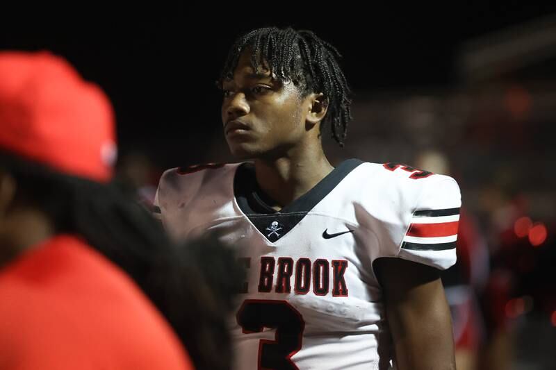 Bolingbrook’s Chico Thomas stands on the sidelines between series against Lincoln-Way West on Friday, Sept. 22 in New Lenox.