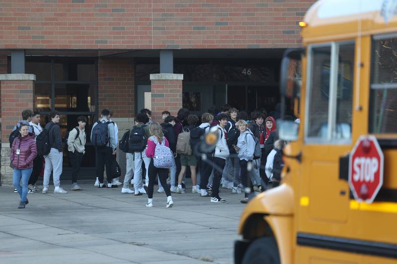 Lockport students line up outside on the first day of classes at the former Lincoln-Way North High School while the Central campus undergoes repairs on Wednesday, Nov. 15, 2023, in Frankfort.