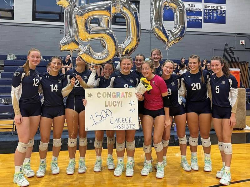 IC Catholic Prep setter Lucy Russ was honored prior to Tuesday's match for recording her 1,500th career assist at this past weekend's Timothy Christian/Westmont Tournament.