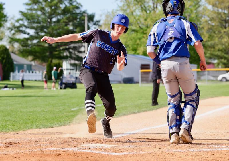 Newman courtesy runner Jacob Payne scores a run for the Comets Tuesday at Princeton. The Comets won 3-2.