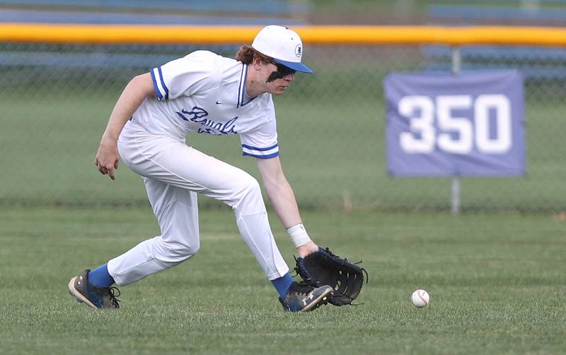 Hinckley-Big Rock's Judson Scott fields a ground ball in the outfield Monday, May 16, 2022, at Hinckley-Big Rock High School during the play-in game against Indian Creek to decide who will advance to participate in the Class 1A Somonauk Regional.