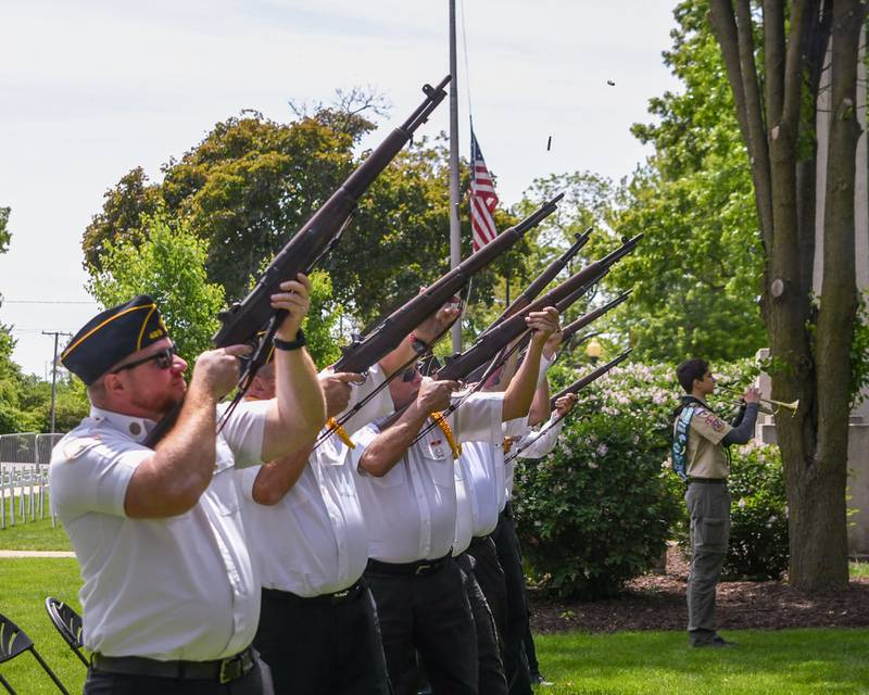 Shell casings fly as the Yorkville American Legion does a 21-gun salute during the Memorial Day event on Monday May 26, 2025, held at Towns Square Park in Yorkville.