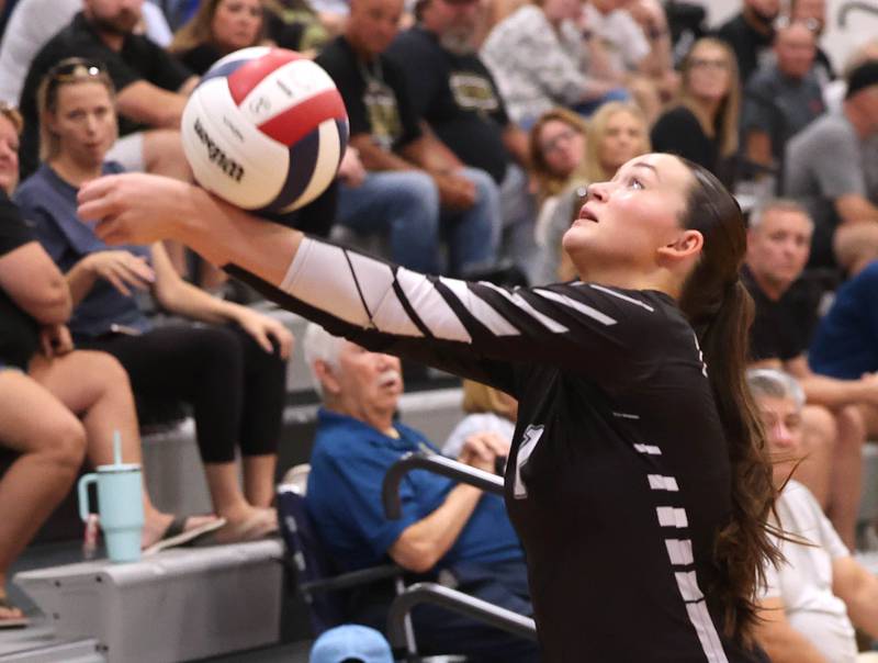 Kaneland's Grace Remsen saves the ball from going into the bleachers during their match against Sycamore Tuesday, Sept. 30, 2025, at Kaneland High School in Maple Park.