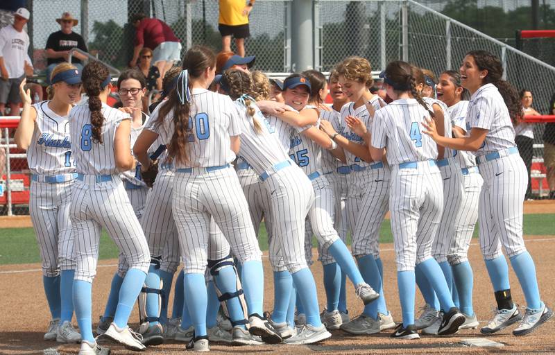 Members of the Oak Park River Forest softball team celebrate on the mound after winning the Class 4A thrid place game over Lockport on Saturday, June 14, 2025 at the Louisvile Slugger Complex in Peoria.