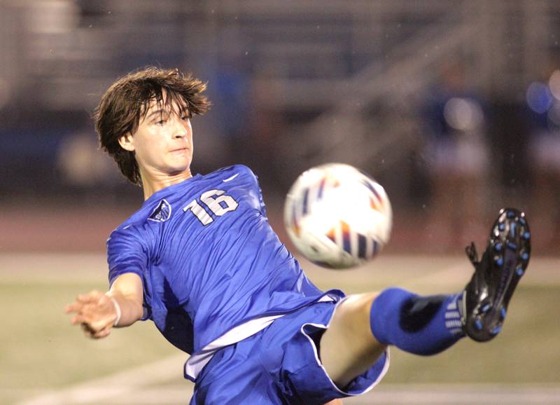 St. Charles North’s Brandon Cotteleer high kicks the ball during a Tri-Cities Night game against St. Charles East at St. Charles North on Thursday, Sept. 21, 2023.