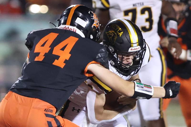 Metea Valley quarterback Lucas Van Vlerah is wrapped up by DeKalb's Nathan Smith during their game Friday, Sept. 16, 2022, at DeKalb High School.