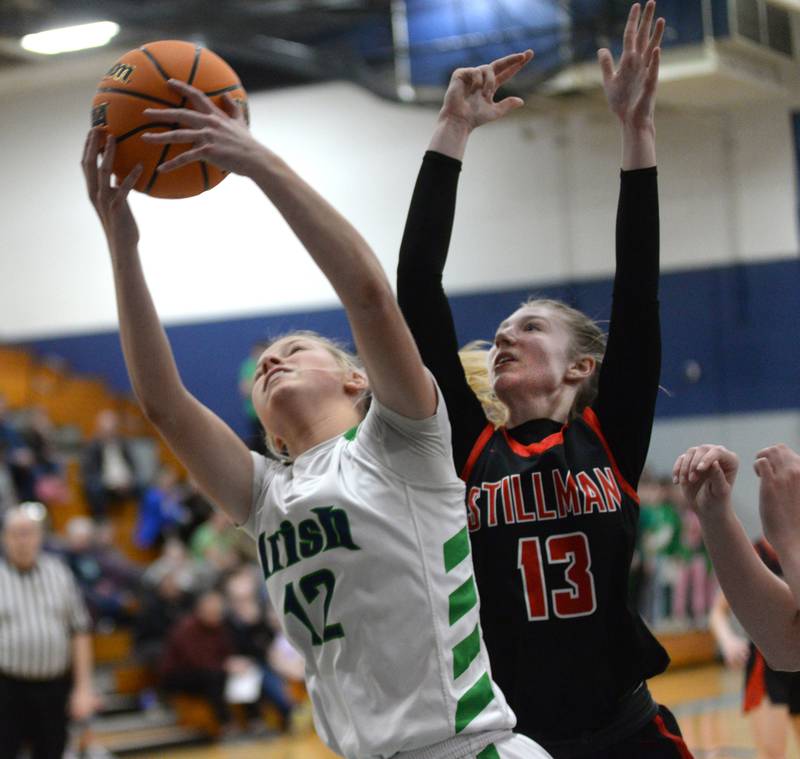 Stillman Valley's Lillian Greene (13) and  Peoria Notre Dame's Ali Stickelmaier (12) battle for a rebound during the 2A Super-Sectional on Monday, March 3, 2025 at Bureau Valley High School in Manlius.