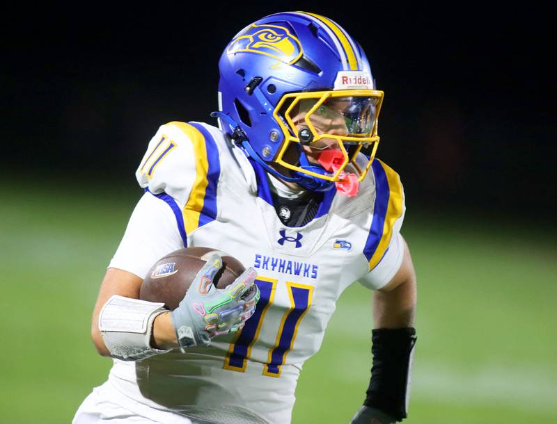 Johnsburg’s Ryan Franze runs the ball in varsity football at Rod Poppe Field on the campus of Marengo High School in Marengo on Friday, Oct. 3, 2025.