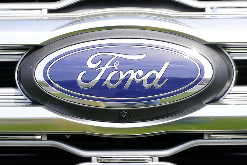 FILE - A logo on a vehicle at a Ford dealership in Springfield, Pa., Tuesday, April 26, 2022. Ford is recalling more than 1.5 million vehicles in the U.S. in two actions to fix leaky brake hoses and windshield wiper arms that can break.  The company says in documents posted Friday, March 17, 2023 by safety regulators that the front brake hoses can rupture and leak brake fluid.  (AP Photo/Matt Rourke, File)