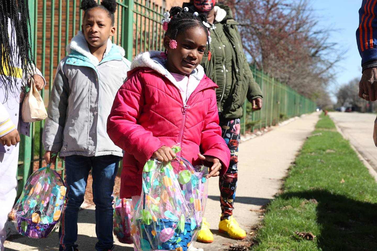 Neaveah Taylor, 6, receives an Easter basketFor years Roger Gates has been giving out Easter baskets in the community. Saturday, April 16, 2022, in Joliet.