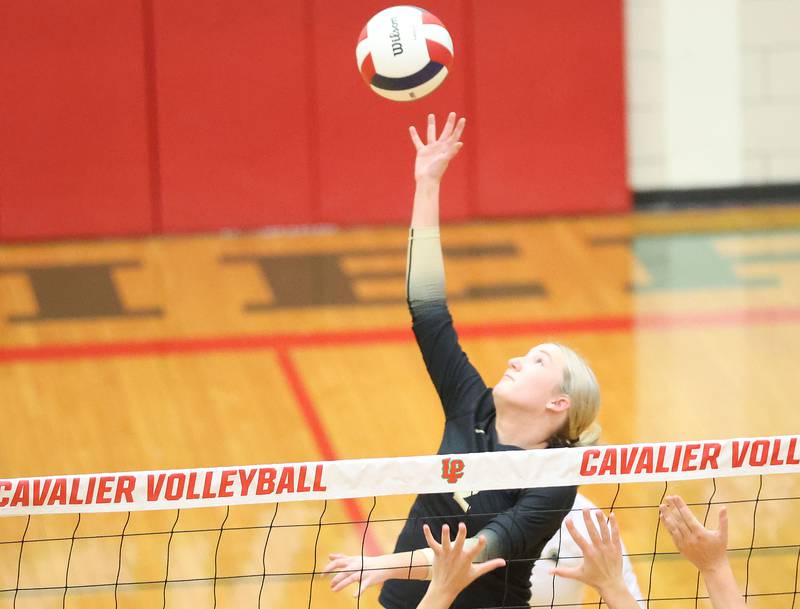 Sycamore's Madilyn Patton reaches up to spike the ball against Washington during the Class 3A Sectional semifinal game on Tuesday, Nov. 4, 2025 in Sellett Gymnasium at L-P High School.
