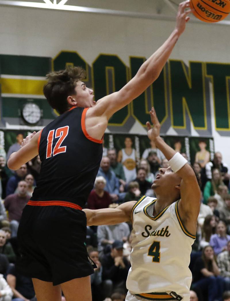 McHenry's Caleb Jett blocks the shot of Crystal Lake South's Anthony Demirov during a Fox Valley Conference basketball game on Friday, Jan. 31, 2025, at Crystal Lake South High School.
