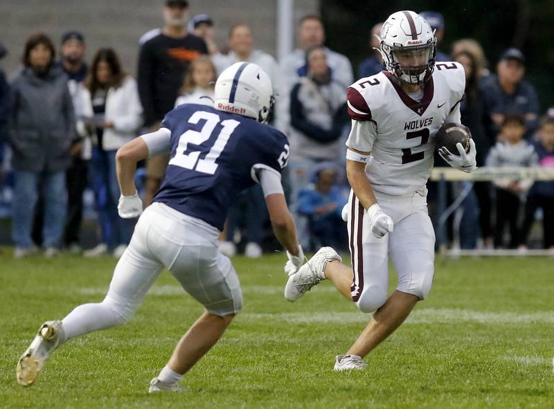 Prairie Ridge's Logan Thennes returns a kick against Cary-Grove's Tanner Hurley during a Fox Valley Conference football game on Friday, Aug. 29, 2025, at Cary-Grove High School in Cary.