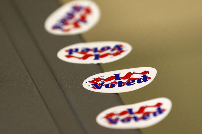 Voting stickers await voters at the ballot drop box on election day at the McHenry County Administrative Building on Tuesday, April 6, 2021 in Woodstock.