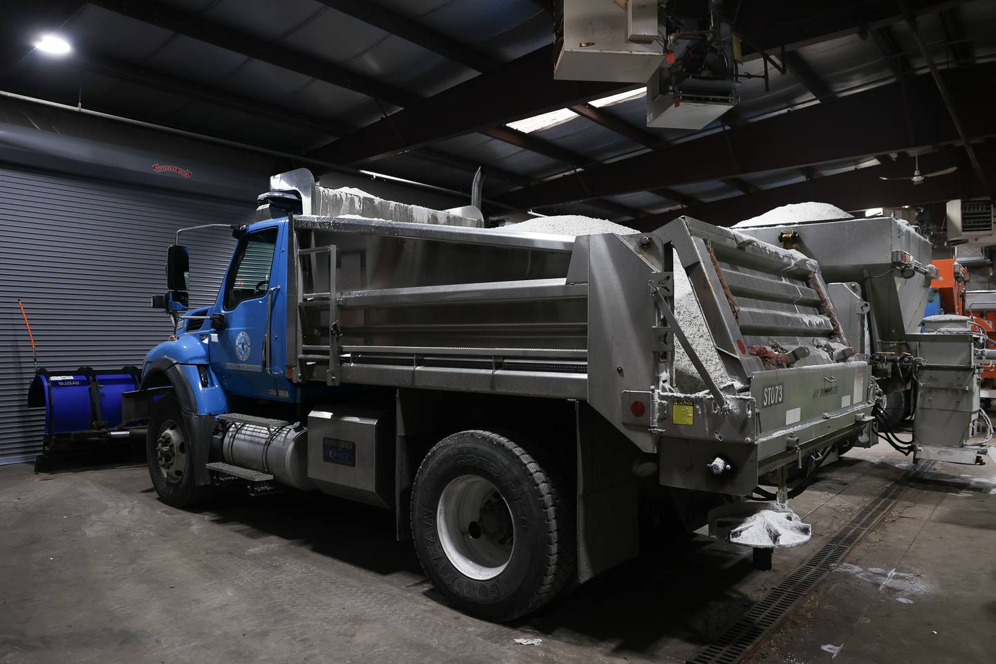 Salt trucks are loaded with salt in preparation for the expected snow fall Monday evening at one of City of Joliet Roadways Division facilities on Monday, Jan. 8th, 2024 in Joliet.