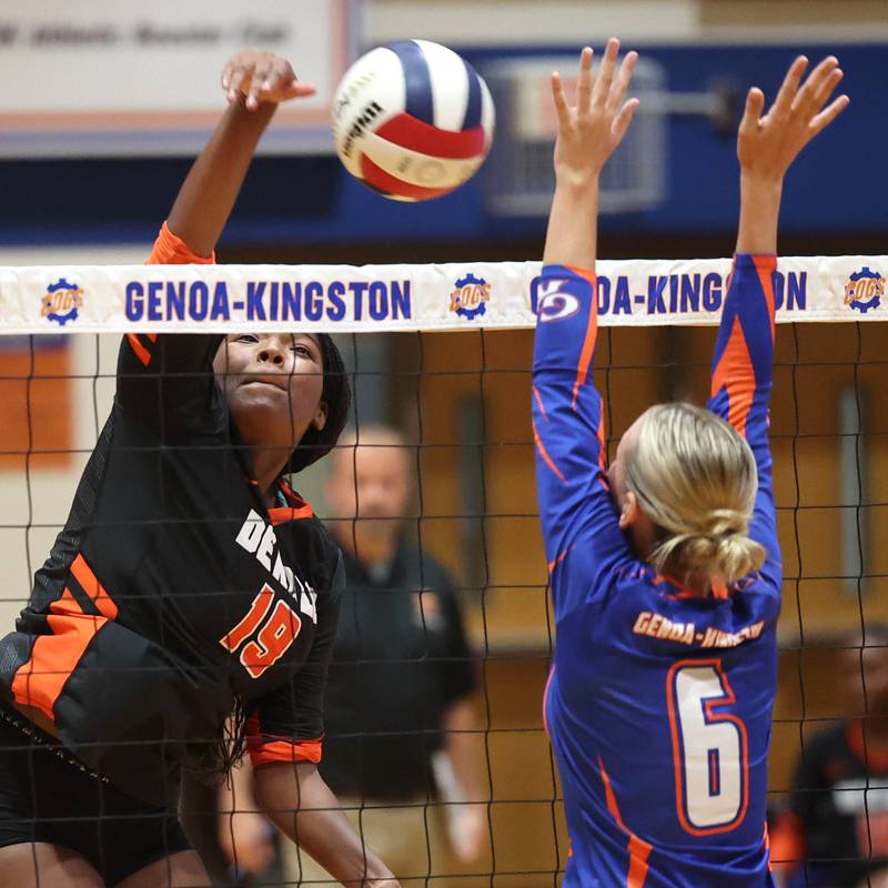 DeKalb’s Jordan Grant spikes the ball as Genoa-Kingston's Addy Vicary tries to block during their game Wednesday, Sept. 11, 2024, at Genoa-Kingston High School.