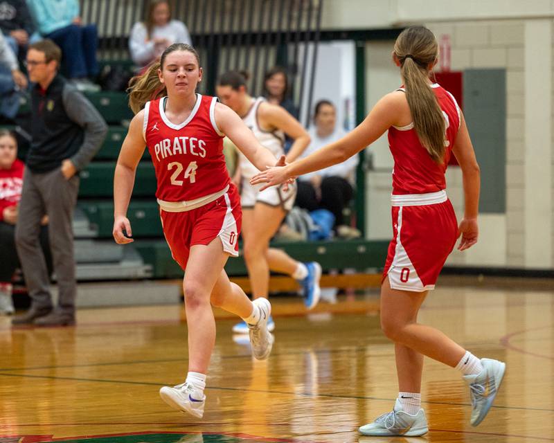 Kennedy Kane (24) of Ottawa high-fives teammate Ashlynn Ganiere (2) after scoring 3-pointer on Wednesday, December 17, 2025 at Sellet Gymnasium in LaSalle.