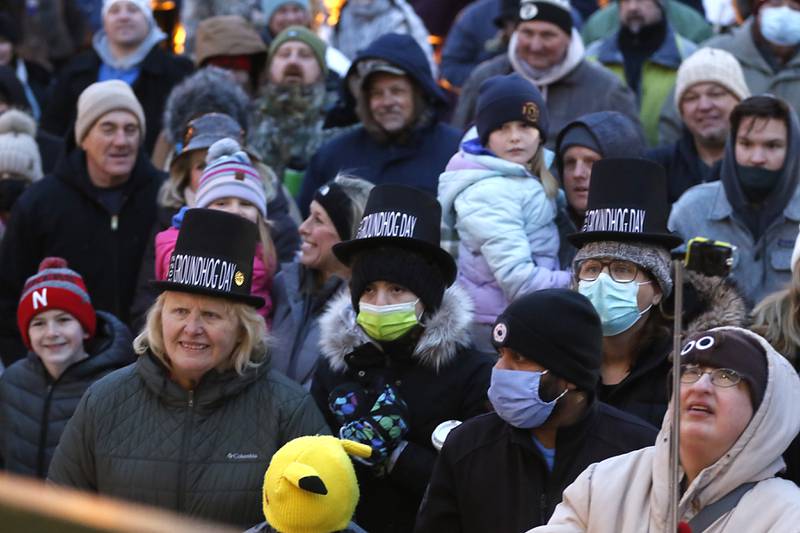 People watch as Woodstock Willie makes his prognostication of an early spring Wednesday, Feb, 2, 2022, during the annual Groundhog Day Prognostication on the historic Woodstock Square. This is the 30th anniversary of the movie "Groundhog Day" that was filmed in Woodstock.