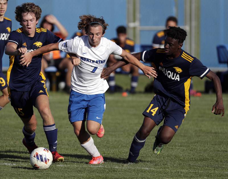 Neuqua Valley's Thomas Melvin (15) and Ayel Kikama (14) try to get to St Charles North's Arnel Dizdarevic (7) Thursday September 8, 2022 in Naperville.