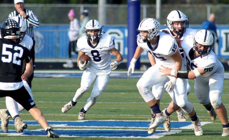 Cary-Grove’s Andrew Prio runs the ball against Highland Park in second-round IHSA Class 6A playoff action at Wolters Field in Highland Park Saturday.